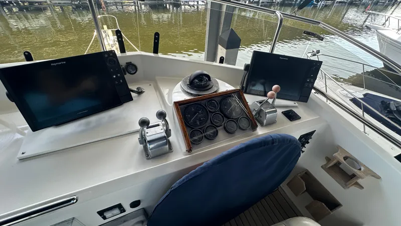 Slide: The Image of 1987 Grand Banks 46 Classic helm with navigation equipment and controls. - 20