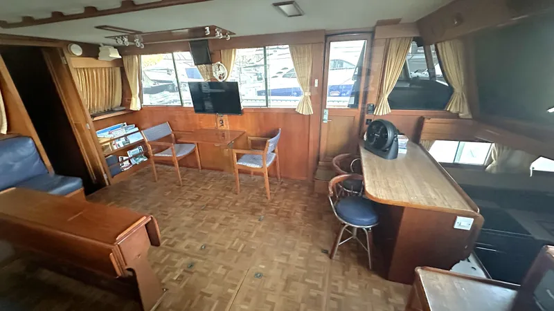 Slide: The Image of Interior of 1987 Grand Banks 46 Classic yacht with wood furnishings and seating area. - 23