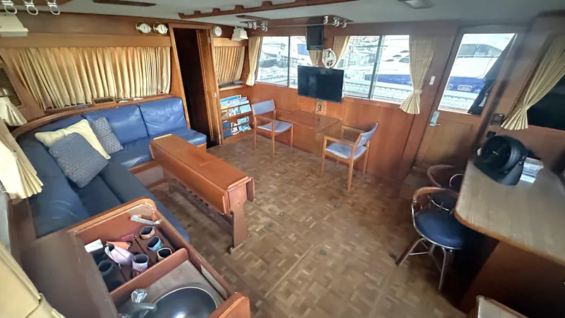 Slide: The Image of Interior of 1987 Grand Banks 46 Classic yacht with wood paneling and seating area. - 25