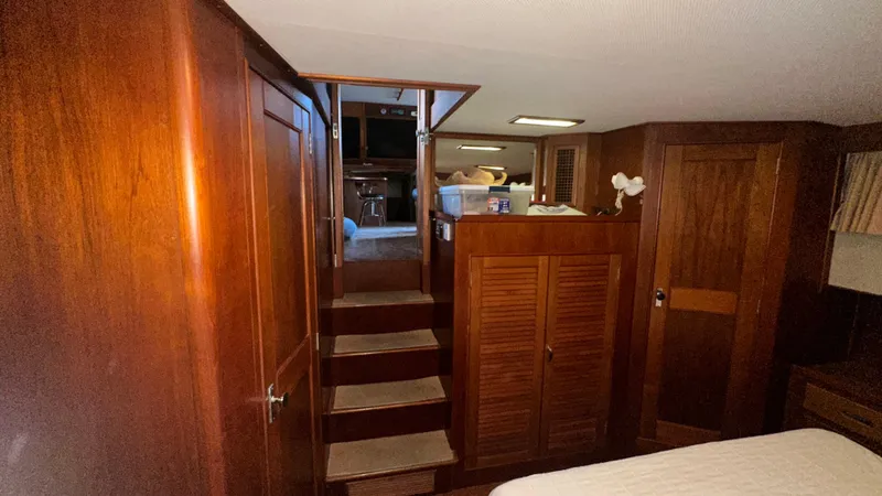 Slide: The Image of Interior of 1987 Grand Banks 46 Classic yacht with wooden cabinetry and stairs. - 37