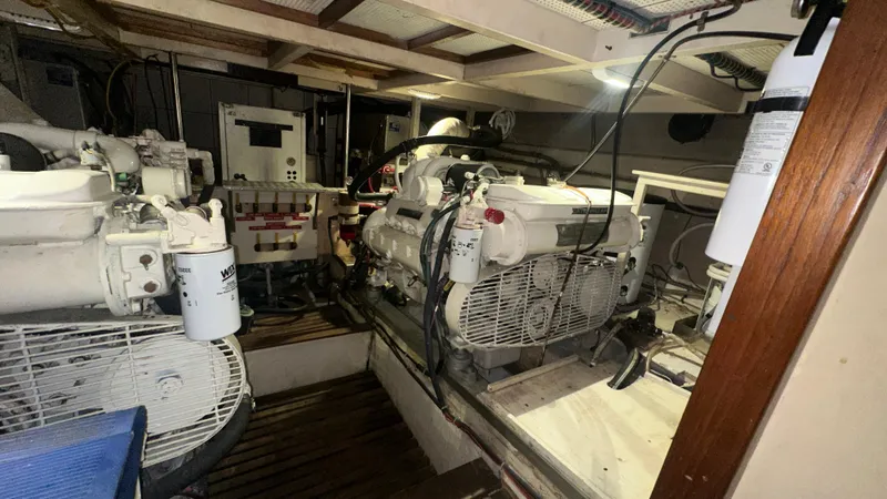 Slide: The Image of Engine room of 1987 Grand Banks 46 Classic yacht, featuring dual engines and equipment. - 39