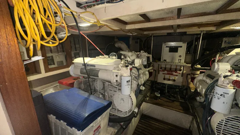 Slide: The Image of Engine room of 1987 Grand Banks 46 Classic yacht, featuring mechanical equipment and wiring. - 40