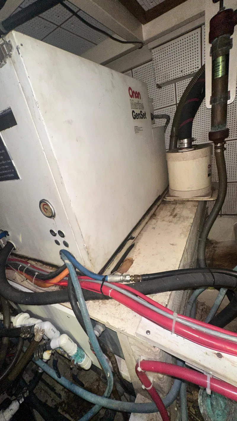 Slide: The Image of Engine room of 1987 Grand Banks 46 Classic with generator and wiring. - 45