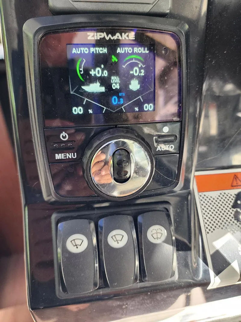 Slide: The Image of Control panel of 2023 Jeanneau NC Sport 895 with Zipwake auto pitch and roll system. - 20