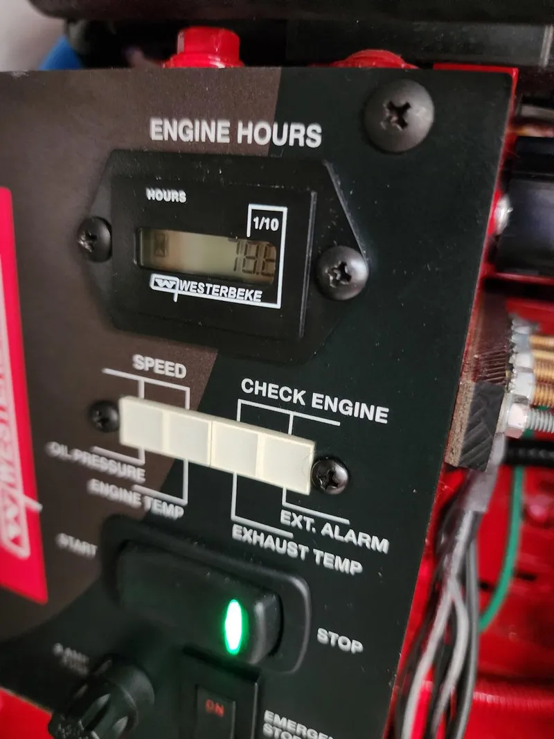 Slide: The Image of Engine control panel of 2023 Jeanneau NC Sport 895, displaying engine hours and indicators. - 26