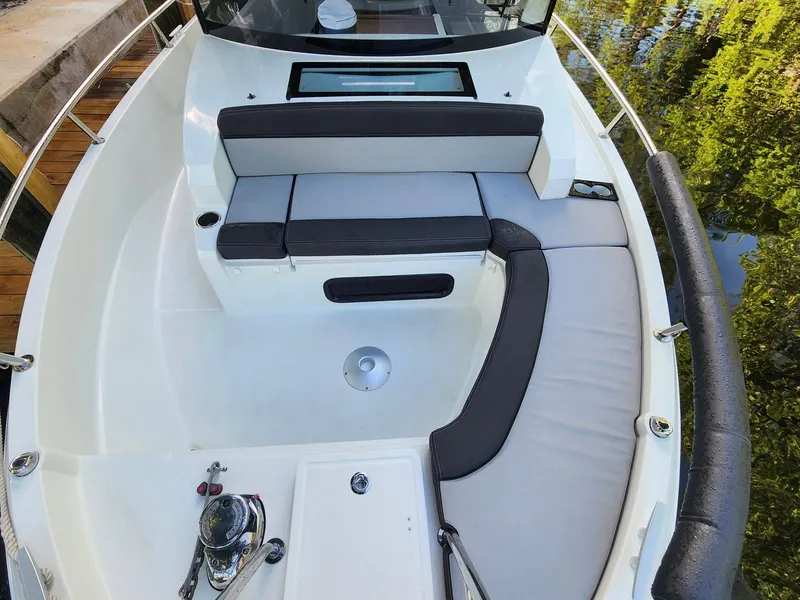 Slide: The Image of 2023 Jeanneau NC Sport 895 boat interior with cushioned seating and sleek design. - 5