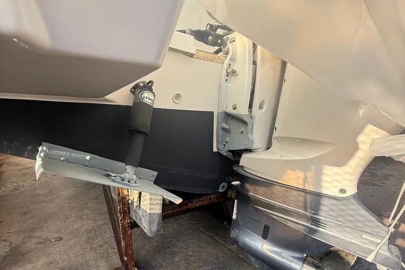 Slide: The Image of 2020 Pursuit DC 235 Dual Console boat's stern and outboard motor detail. - 5