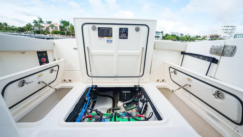 Slide: The Image of 2023 Boston Whaler 280 Vantage boat storage compartments open, showcasing interior details. - 41