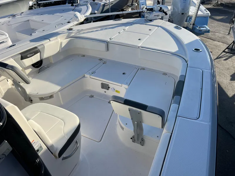 Slide: The Image of 2025 Robalo 266 Cayman SD boat interior with seating and storage compartments. - 12