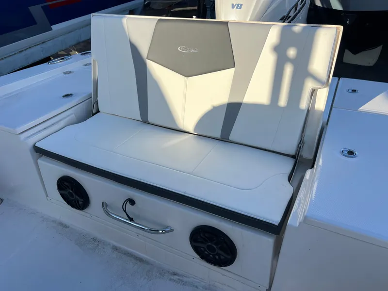 Slide: The Image of 2025 Robalo 266 Cayman SD boat seat with speakers and storage. - 16