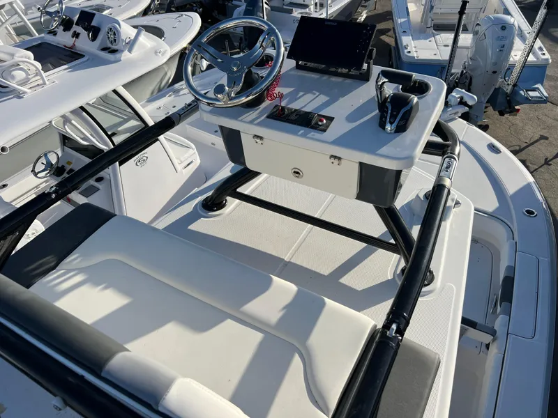Slide: The Image of 2025 Robalo 266 Cayman SD boat helm with steering wheel and controls. - 17