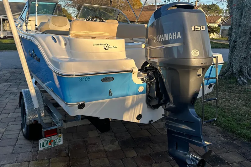 Slide: The Image of 2015 NauticStar 2000 XSDC boat with Yamaha 150 engine on a trailer. - 24