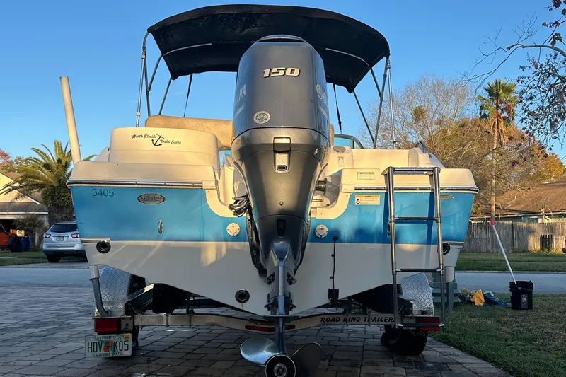 Slide: The Image of 2015 NauticStar 2000 XSDC boat with 150 HP engine on trailer. - 25