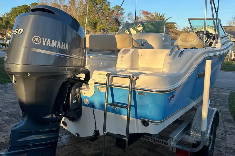 Slide: The Image of 2015 NauticStar 2000 XSDC boat with Yamaha 150 engine on trailer. - 27