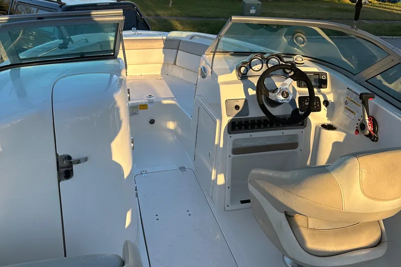 Slide: The Image of 2015 NauticStar 2000 XSDC boat interior with steering wheel and seating. - 29