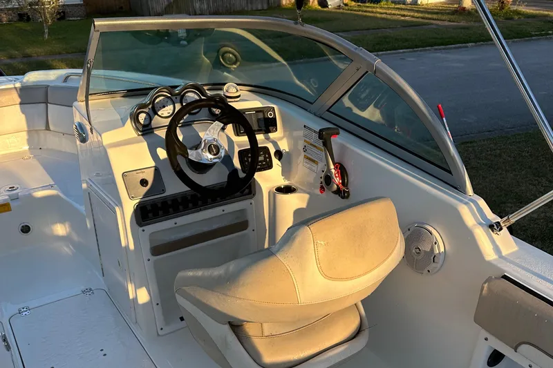 Slide: The Image of 2015 NauticStar 2000 XSDC boat interior with steering wheel and seating. - 32