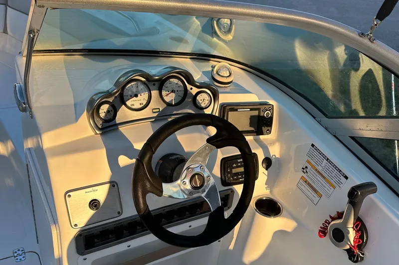 Slide: The Image of 2015 NauticStar 2000 XSDC boat dashboard with steering wheel and gauges. - 35