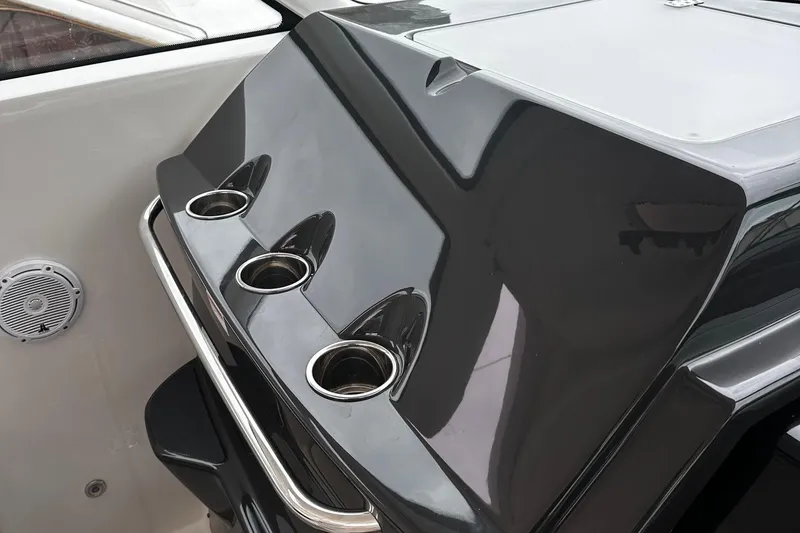 Slide: The Image of 2023 Tiara Yachts 43 Open, sleek console design with cup holders and stainless steel rail. - 17