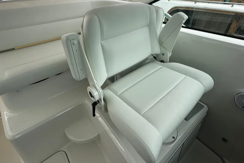 Slide: The Image of 2023 Tiara Yachts 43 Open interior with white seating and modern design. - 18