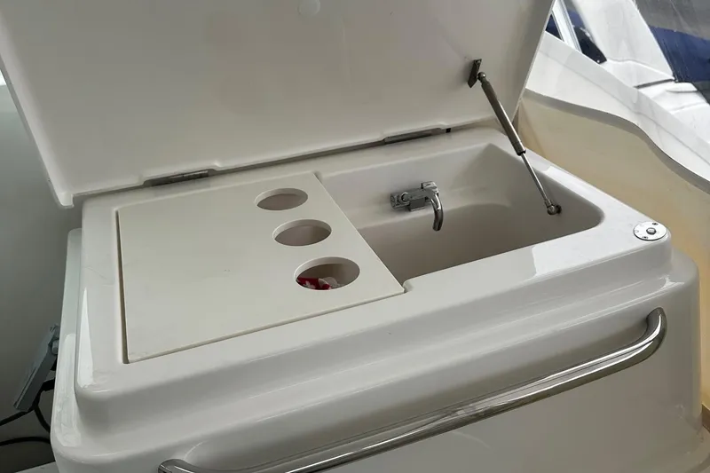 Slide: The Image of 2023 Tiara Yachts 43 Open sink area with cover and faucet. - 20