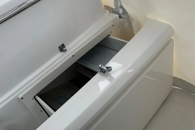 Slide: The Image of 2023 Tiara Yachts 43 Open storage compartment with open lid. - 21