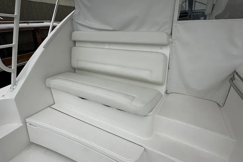 Slide: The Image of 2023 Tiara Yachts 43 Open interior seating area with white upholstery. - 22