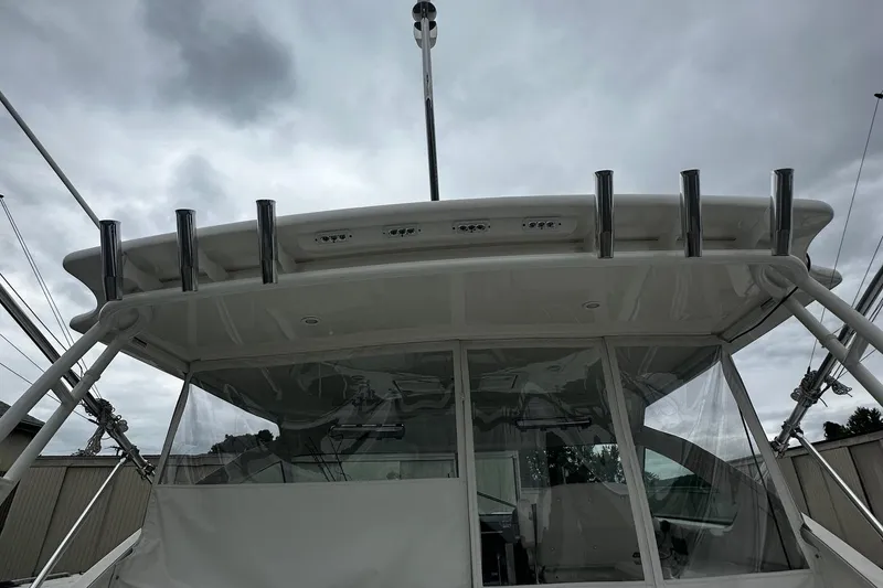 Slide: The Image of 2023 Tiara Yachts 43 Open, rear view under cloudy sky. - 24