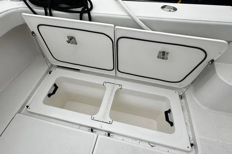 Slide: The Image of Storage compartment on 2023 Tiara Yachts 43 Open boat, featuring dual access doors. - 29