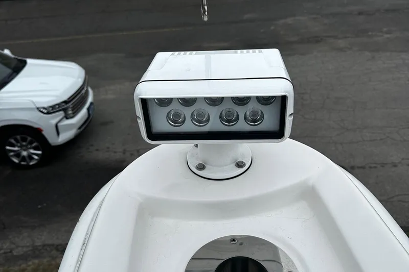 Slide: The Image of LED light fixture on 2023 Tiara Yachts 43 Open, with a vehicle in the background. - 33