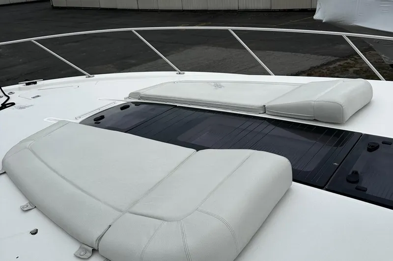 Slide: The Image of 2023 Tiara Yachts 43 Open deck with cushioned seating and sleek design. - 34