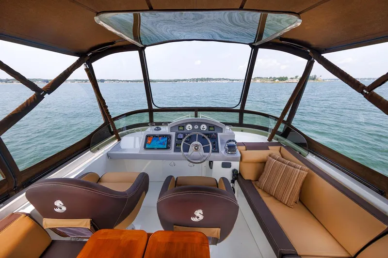 Slide: The Image of 2016 Beneteau Swift Trawler 44 helm with panoramic water view. - 39