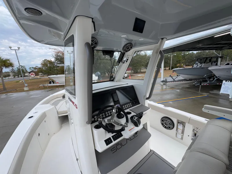 Slide: The Image of 2025 Solace 28 HCS boat cockpit with modern controls and seating. - 37