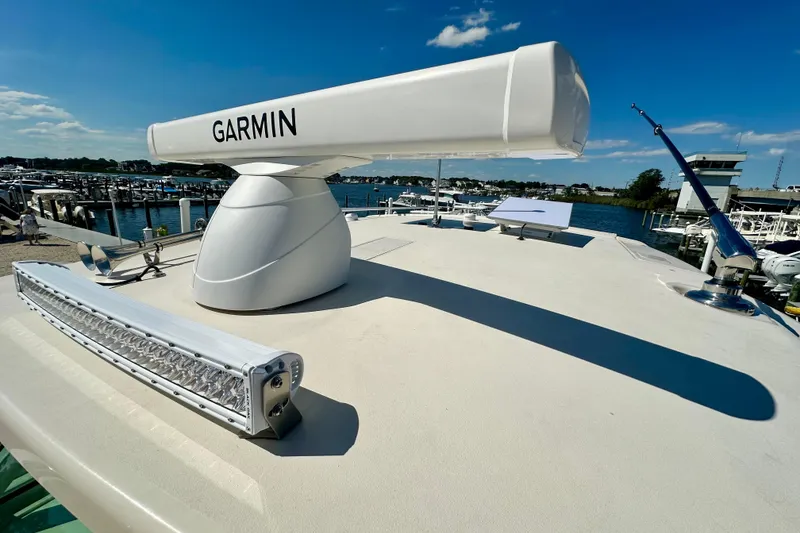Slide: The Image of 2025 Grady-White Canyon 386 boat with Garmin radar at marina. - 4