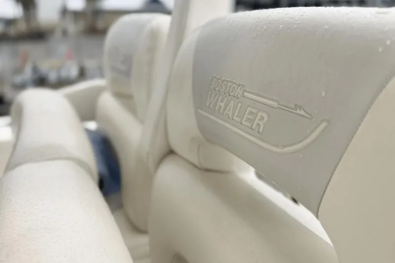 Slide: The Image of Close-up of 2015 Boston Whaler 280 Outrage seat with logo and water droplets. - 14