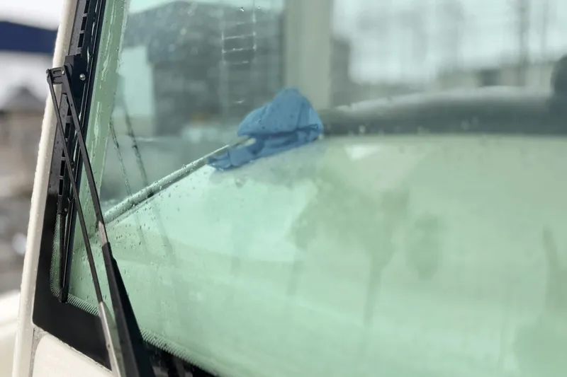 Slide: The Image of Close-up of 2015 Boston Whaler 280 Outrage windshield with raindrops and wiper. - 17