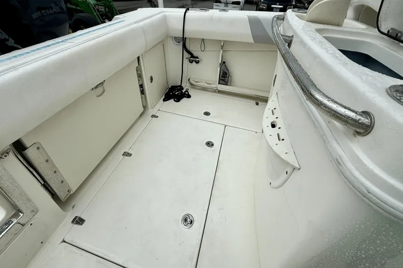 Slide: The Image of 2015 Boston Whaler 280 Outrage boat interior with storage compartments and seating. - 19