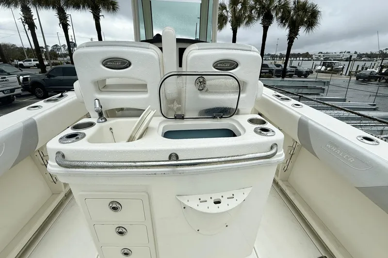 Slide: The Image of 2015 Boston Whaler 280 Outrage boat interior with fishing station and storage compartments. - 8