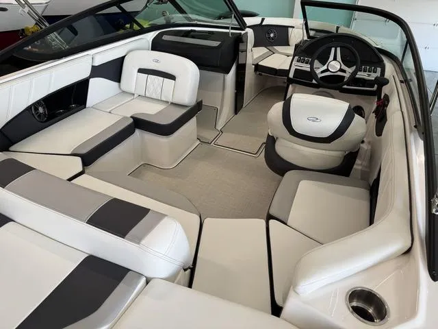 Slide: The Image of 2023 Regal 2000 ES boat interior with sleek white and gray seating. - 10