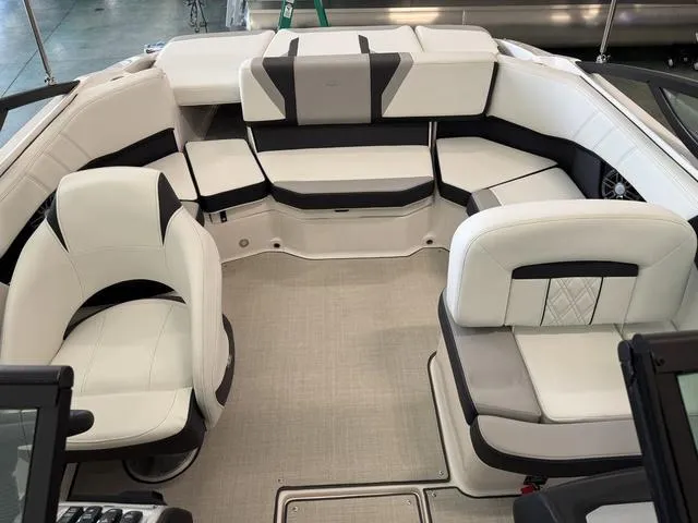 Slide: The Image of 2023 Regal 2000 ES boat interior with white and black seating arrangement. - 11