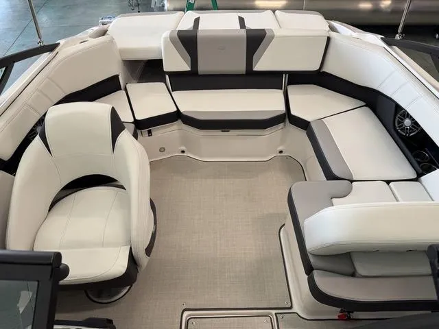 Slide: The Image of 2023 Regal 2000 ES boat interior with white and black seating arrangement. - 12