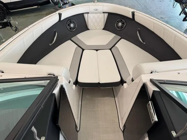 Slide: The Image of Interior of 2023 Regal 2000 ES boat, featuring sleek seating and modern design elements. - 15