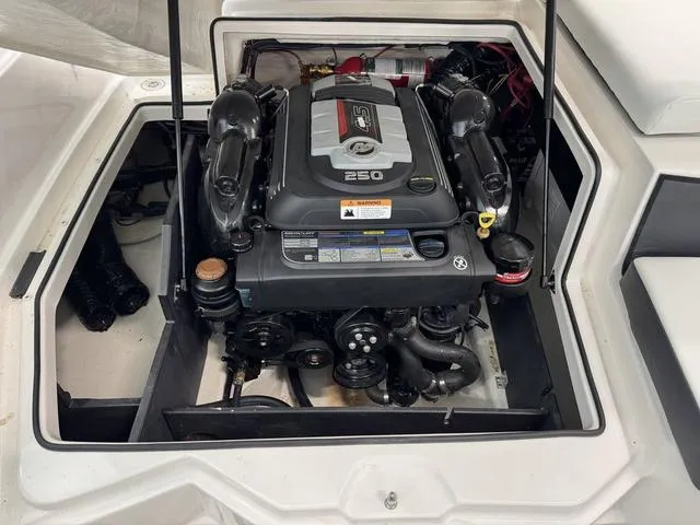 Slide: The Image of 2023 Regal 2000 ES boat engine compartment with a 250 HP engine. - 20