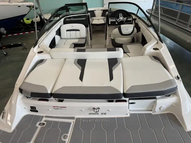 Slide: The Image of 2023 Regal 2000 ES boat interior with sleek seating and modern design. - 7