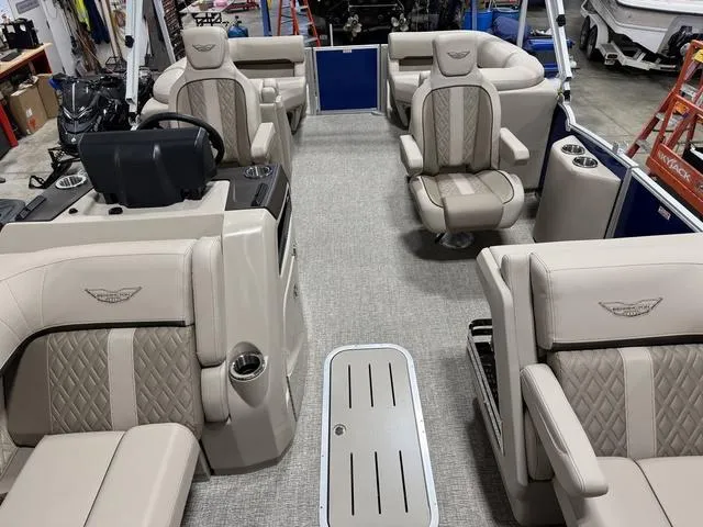 Slide: The Image of 2025 Bennington M Quad Bench 24 MFB interior with luxurious seating and modern design. - 6