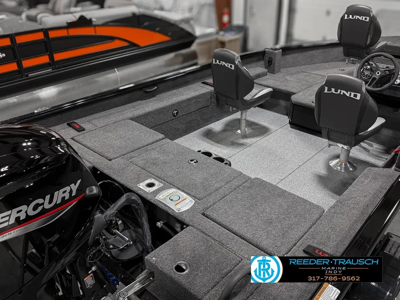 Slide: The Image of 2025 Lund 1775 Impact XS boat interior with Mercury engine and seating. - 12