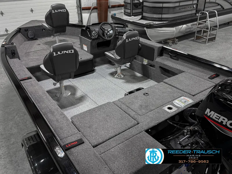 Slide: The Image of 2025 Lund 1775 Impact XS Single boat interior with seating and steering console. - 13