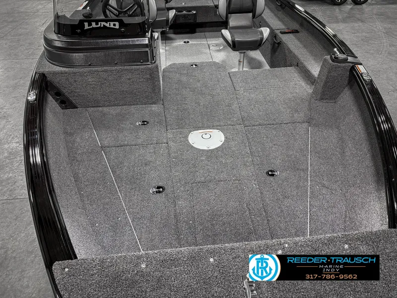 Slide: The Image of 2025 Lund 1775 IMPACT XS SINGLE boat interior with gray carpet and seating. - 20