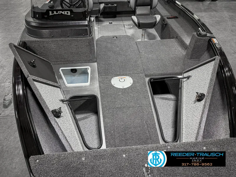 Slide: The Image of 2025 Lund 1775 IMPACT XS SINGLE boat interior with storage compartments open. - 21