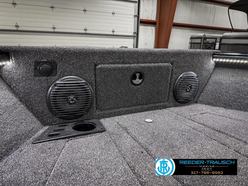 Slide: The Image of 2025 Lund 1775 Impact XS boat interior with speakers and storage compartment. - 22