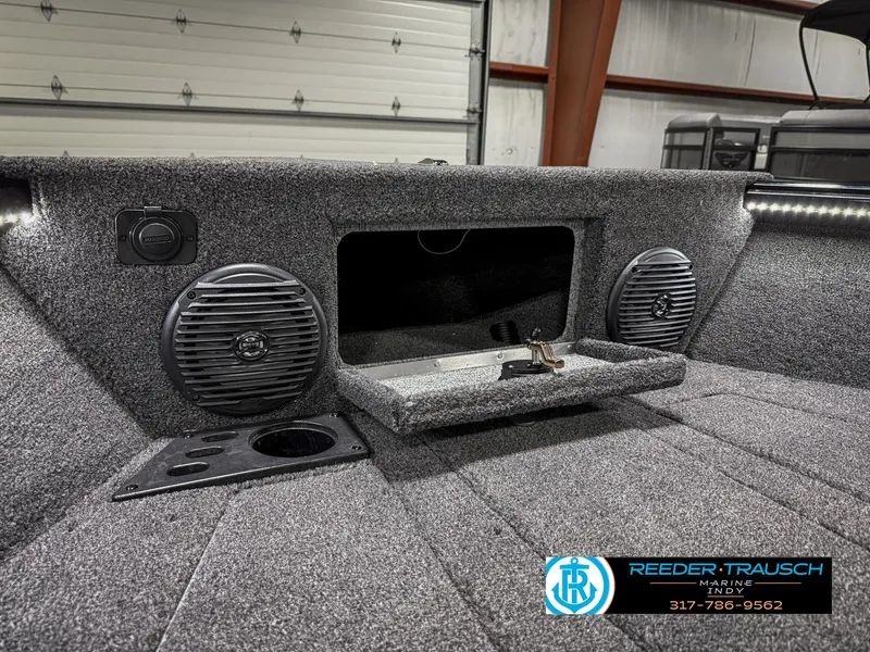 Slide: The Image of 2025 Lund 1775 Impact XS boat interior with speakers and storage compartment. - 23